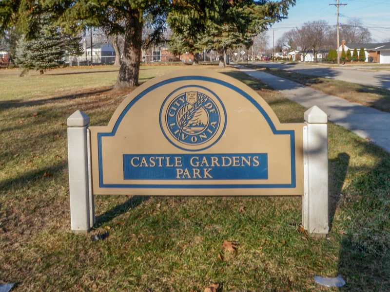 The sign welcoming residents to Castle Garden Park in Livonia, MI.