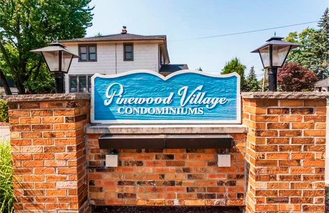 The welcome sign at Pinewood Village Condos in Plymouth, Michigan.
